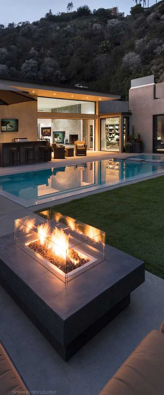 This glass-framed fire pit is ideal for a backyard with such clean lines. Via Whipple Russell Architects